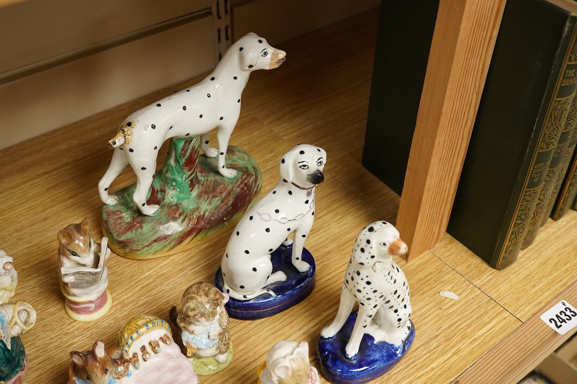 A collection of Beatrix Potter figures, three Staffordshire Dalmatians and a Copenhagen Dalmatian, tallest 16cm high